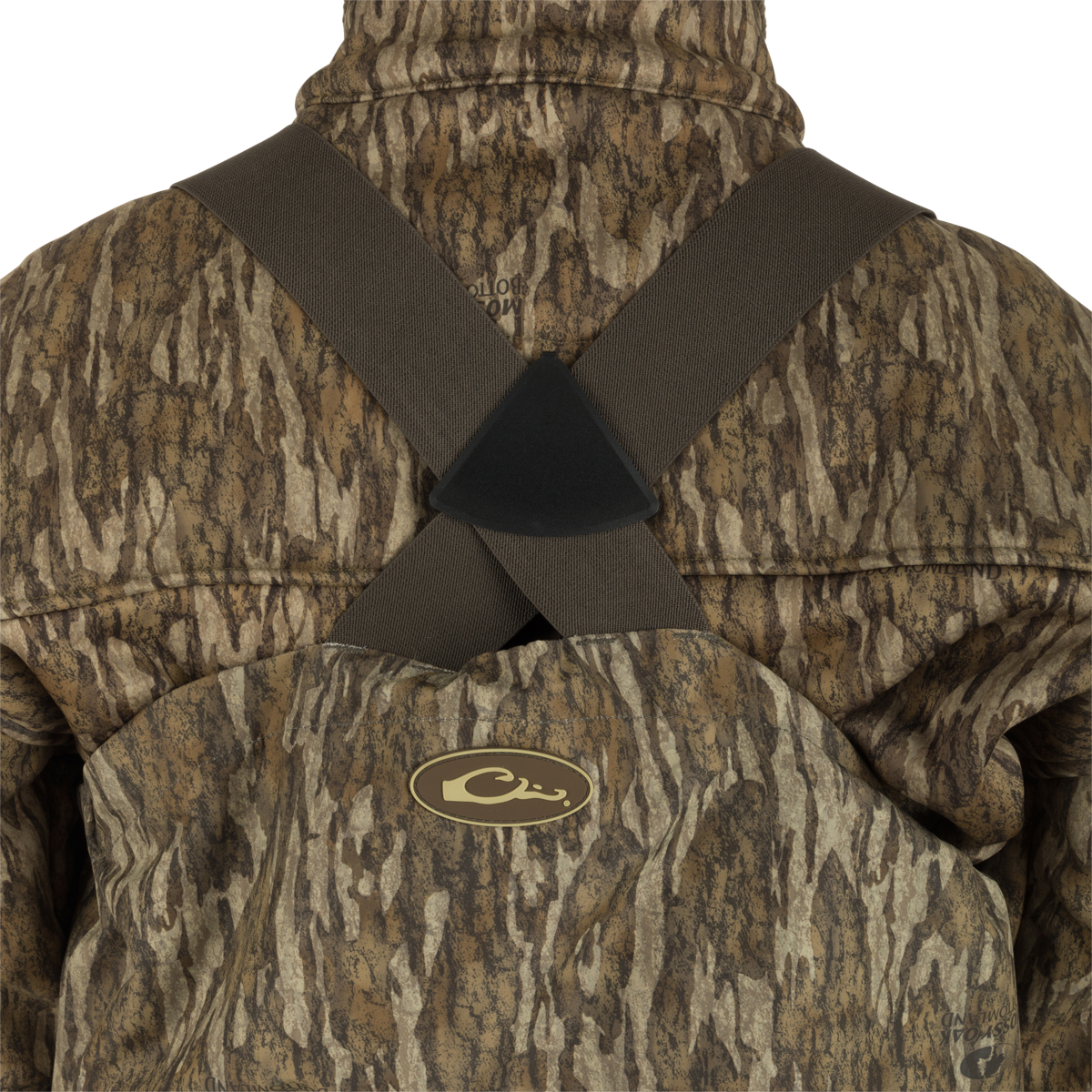 Person wearing the Insulated Guardian Elite HND Front Zip Wader, showcasing its camouflage design and reinforced taped seams for durability.