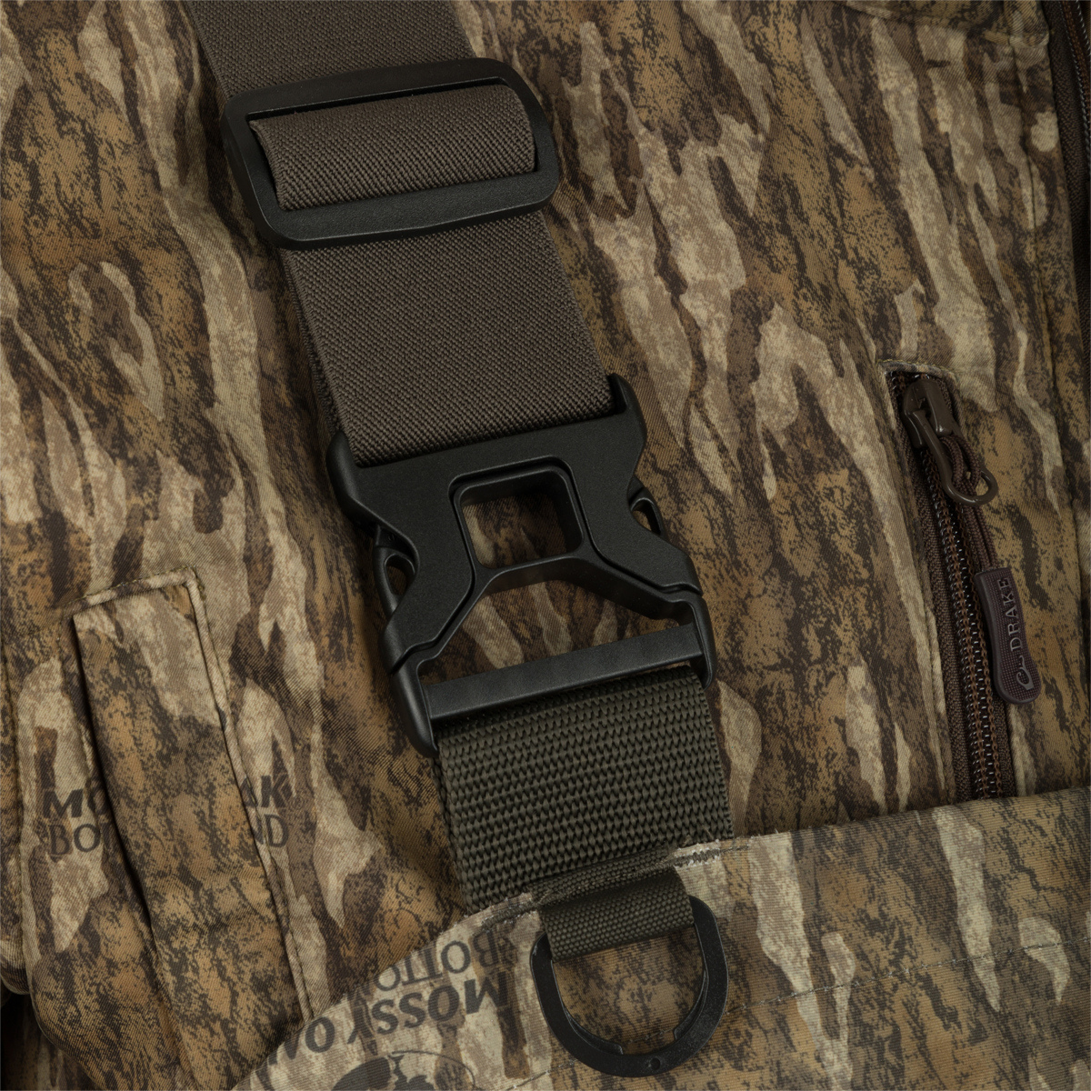 Close-up of the Insulated Guardian Elite HND Front Zip Wader showing reinforced black strap and durable camo fabric with vertical TiZIP® MasterSeal 10 zipper.